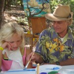 Peter Adams teaches painting techniques to a Pasadena-area youth from the Rose Bowl Aquatic Center Summer Camp during Plein Air Week at Kidspace Children's Museum.