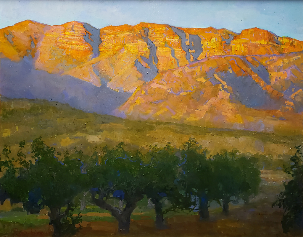 American Legacy Fine Arts presents "The Pink Moment on the Topa Topa Bluffs overlooking an Apricot Orchard; Ojai Valley" a painting by Peter Adams.